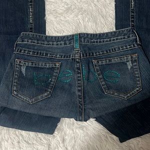 Bebe jeans with turquoise rhinestones on the butt